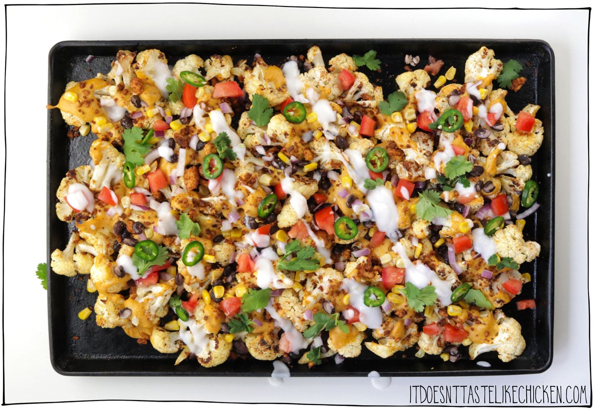 Loaded nachos that are actually healthy!? You heard me right. These cheesy vegan cauliflower nachos are the secretly healthy comfort food of my dreams! Tortilla chips are substituted with roasted cauliflower florets that are then drizzled with a stretchy melty homemade vegan nacho cheese sauce, and loaded with a ton of toppings. YUM!