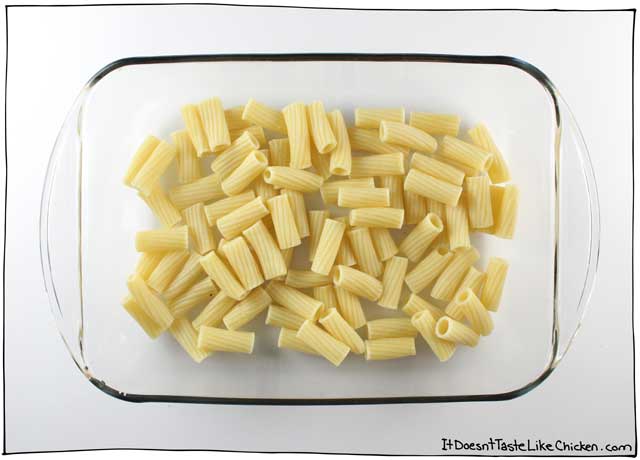 Classic Vegan Baked Ziti. This delicious pasta bake is layered with a simple homemade tomato sauce and my an easy vegan ricotta recipe. Perfect for a dinner party, special Sunday dinner, potluck, or just a night when you feel like you need to good ol’ fashioned home cooking. #itdoesnttastelikechicken