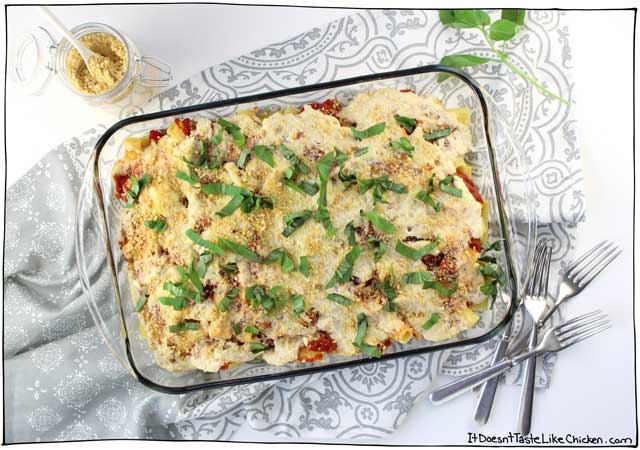 Classic Vegan Baked Ziti. This delicious pasta bake is layered with a simple homemade tomato sauce and my an easy vegan ricotta recipe. Perfect for a dinner party, special Sunday dinner, potluck, or just a night when you feel like you need to good ol’ fashioned home cooking. #itdoesnttastelikechicken