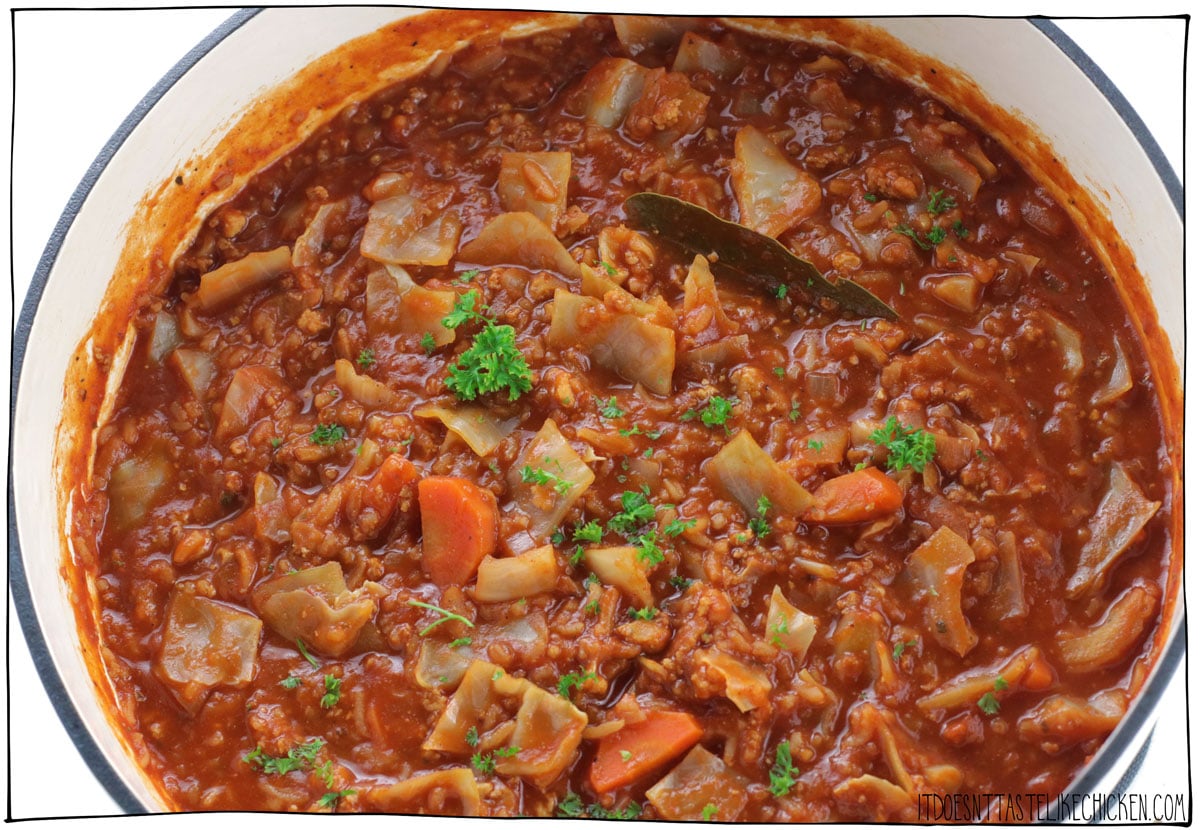 This Easy Vegan Cabbage Roll Soup tastes just like cabbage rolls, but it is so much easier to make! Very hearty and filling and made with easy-to-find and inexpensive ingredients including cabbage, tofu, rice, and canned tomatoes. If you love cabbage rolls, but don't like all the work, this unstuffed cabbage roll soup is for you! #itdoesnttastelikechicken #veganrecipes #soup