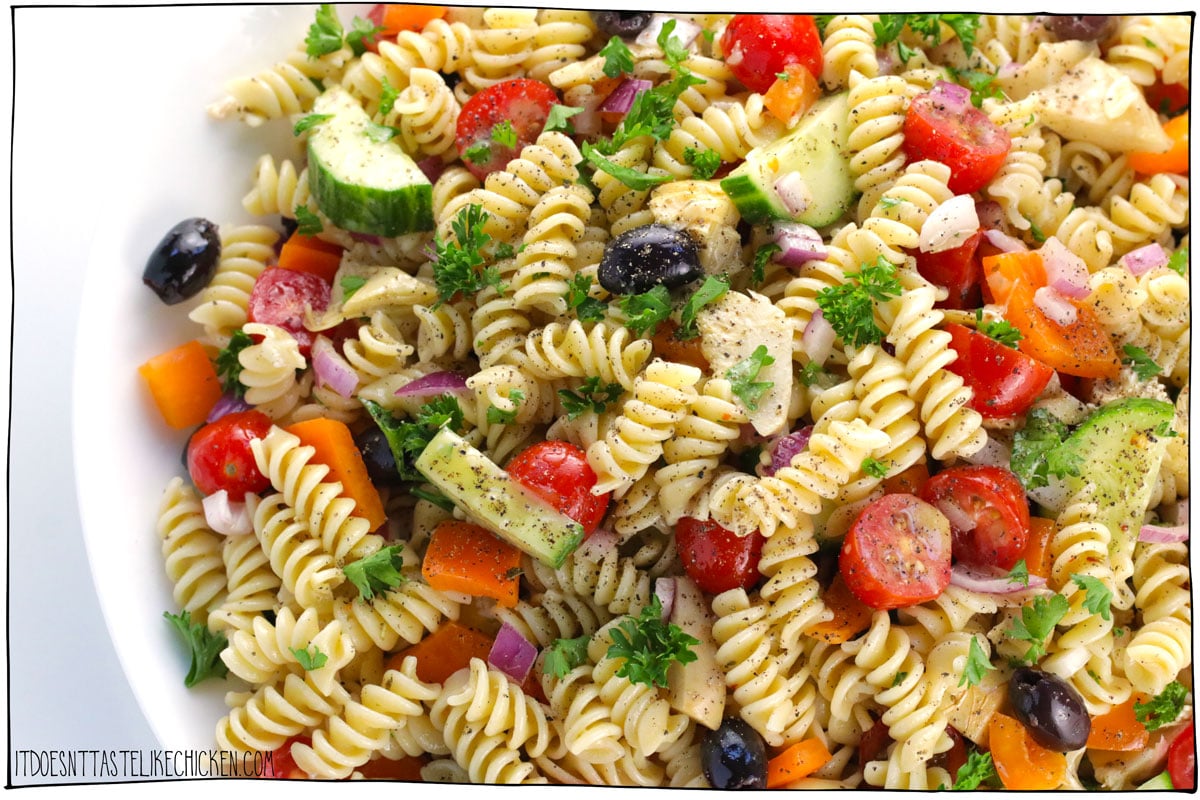 This Easy Vegan Pasta Salad recipe takes just 30 minutes to make, is loaded with fresh vegetables, olives, and artichokes, and is tossed with the best Italian-inspired, 5-minute homemade pasta salad dressing! Perfect for BBQs, picnics, or potlucks, this will be your new go-to recipe this summer!!