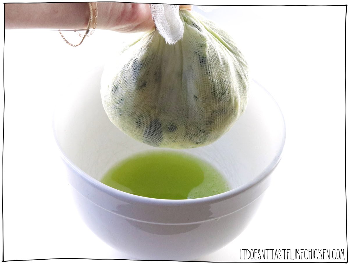 After 10 minutes, wrap the grated zucchini in a cheesecloth or a clean kitchen towel and squeeze out the excess water.