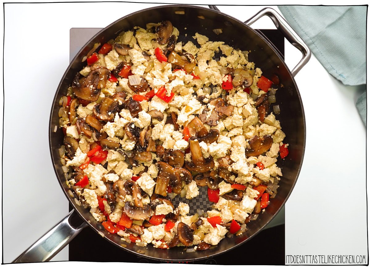 Crumble the tofu into the pan.