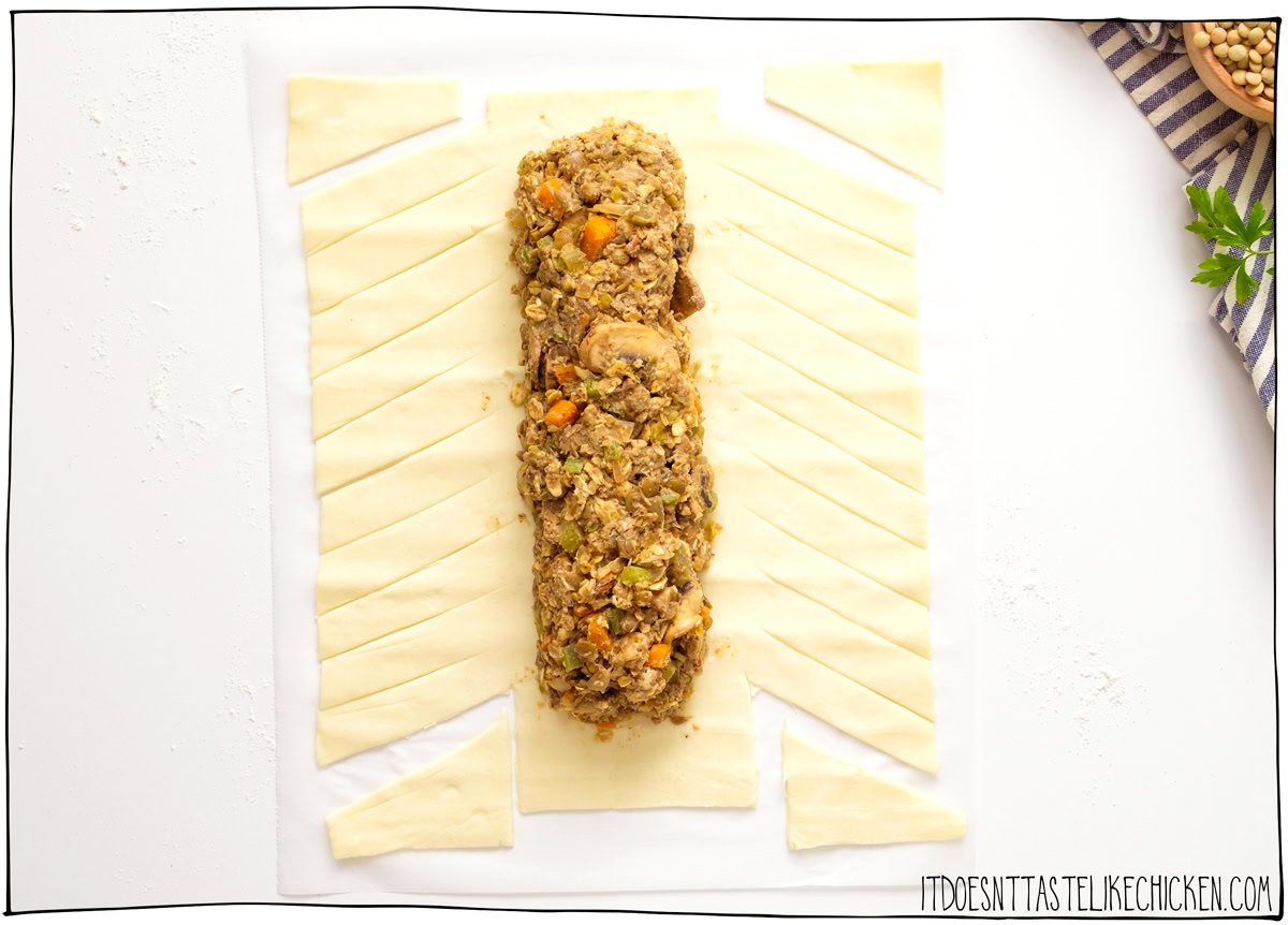 Form a loaf on the puff pastry then using a knife, cut 1-inch-wide strips along the sides of the pastry.