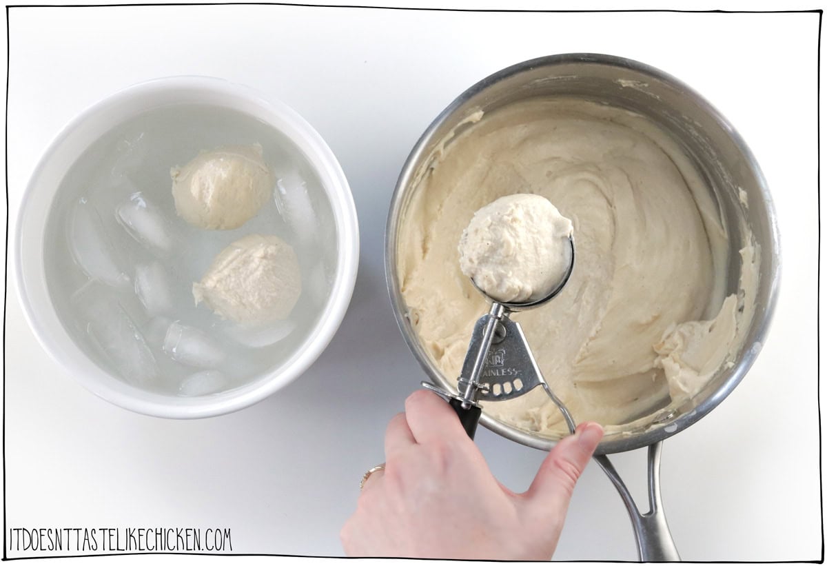 Once the cheese mixture is cooked, use an ice cream scoop, cookie scoop, or spoon and spritz it with a bit of spray oil. You can make the balls as big or as small as you like. Scoop some of the hot cheese mixture and release it directly into the icy brine.
