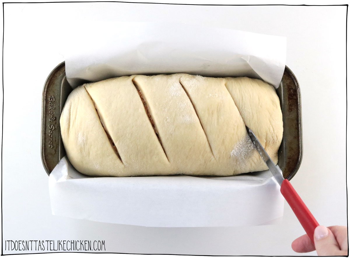 Roll up the dough and place in a bread pan. Score the top of the loaf.