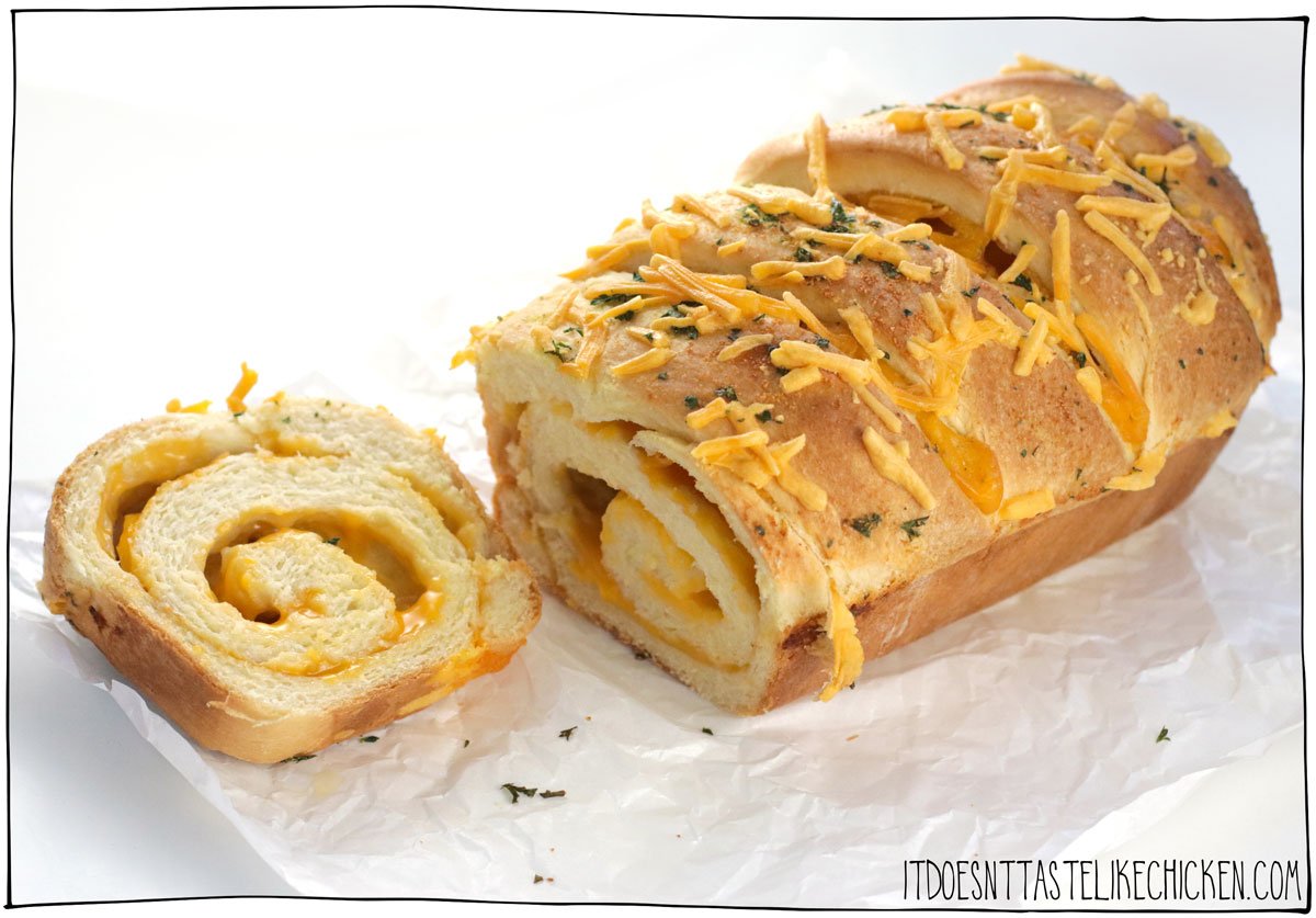 Indulge in the ultimate comfort food with this Vegan Cheese Bread recipe. This homemade cheesy bread is soft and fluffy and infused with the irresistible flavors and aromas of garlic, vegan butter, and swirls of gooey vegan cheese. Perfect for snacking or serving as a side dish with your favorite soup.