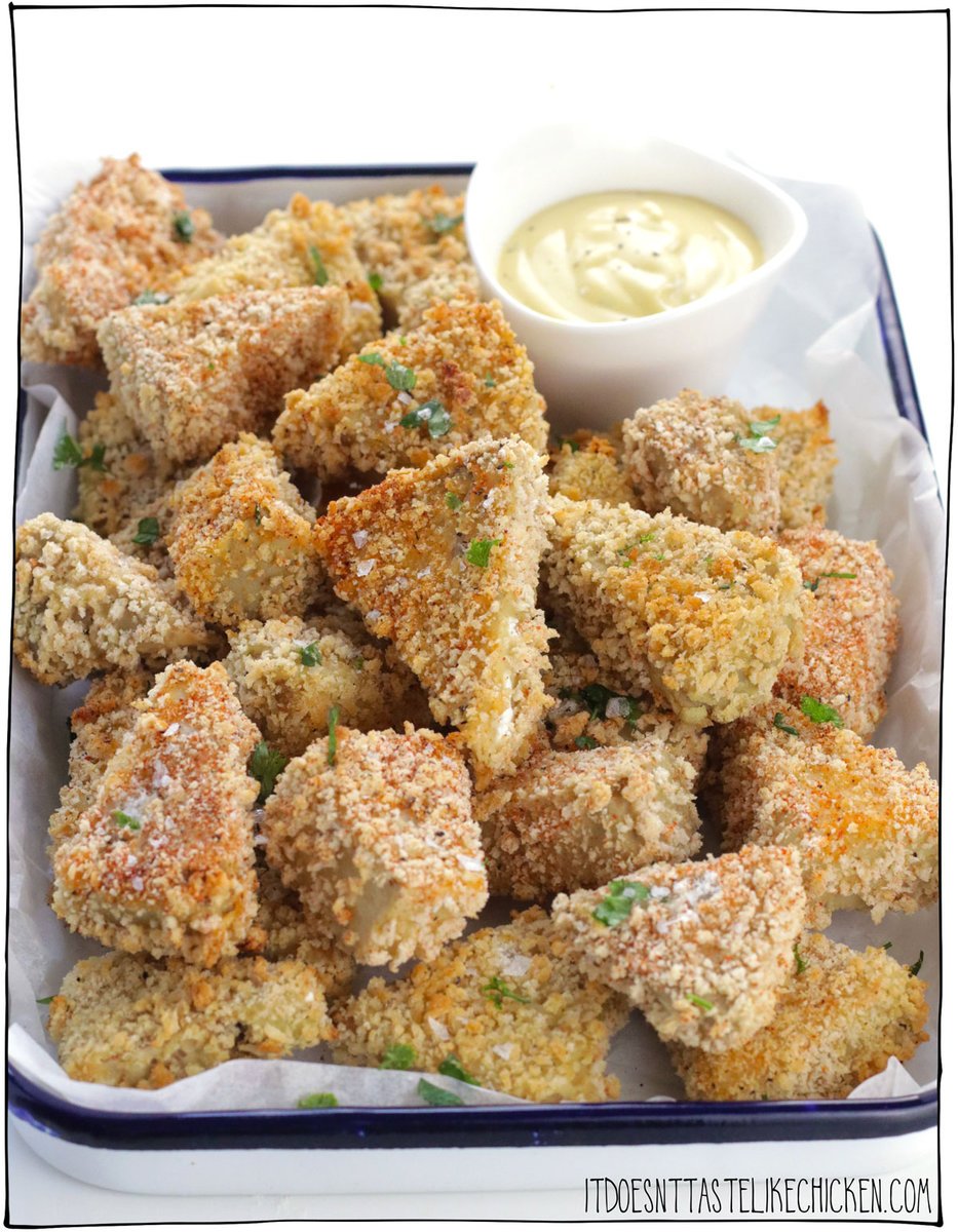 Prepare to be blown away by this Vegan Chicken Nuggets recipe! Crispy crunchy on the outside and juicy, and tender on the inside with an amazing pull-apart texture!  The "chicken" in the recipe is made from jackfruit that is marinated overnight so the jackfruit becomes super flavorful. Next, it's coated in a crispy panko coating and baked, air-fried, or pan-fried (your choice). These might be the best nuggets you'll ever try!