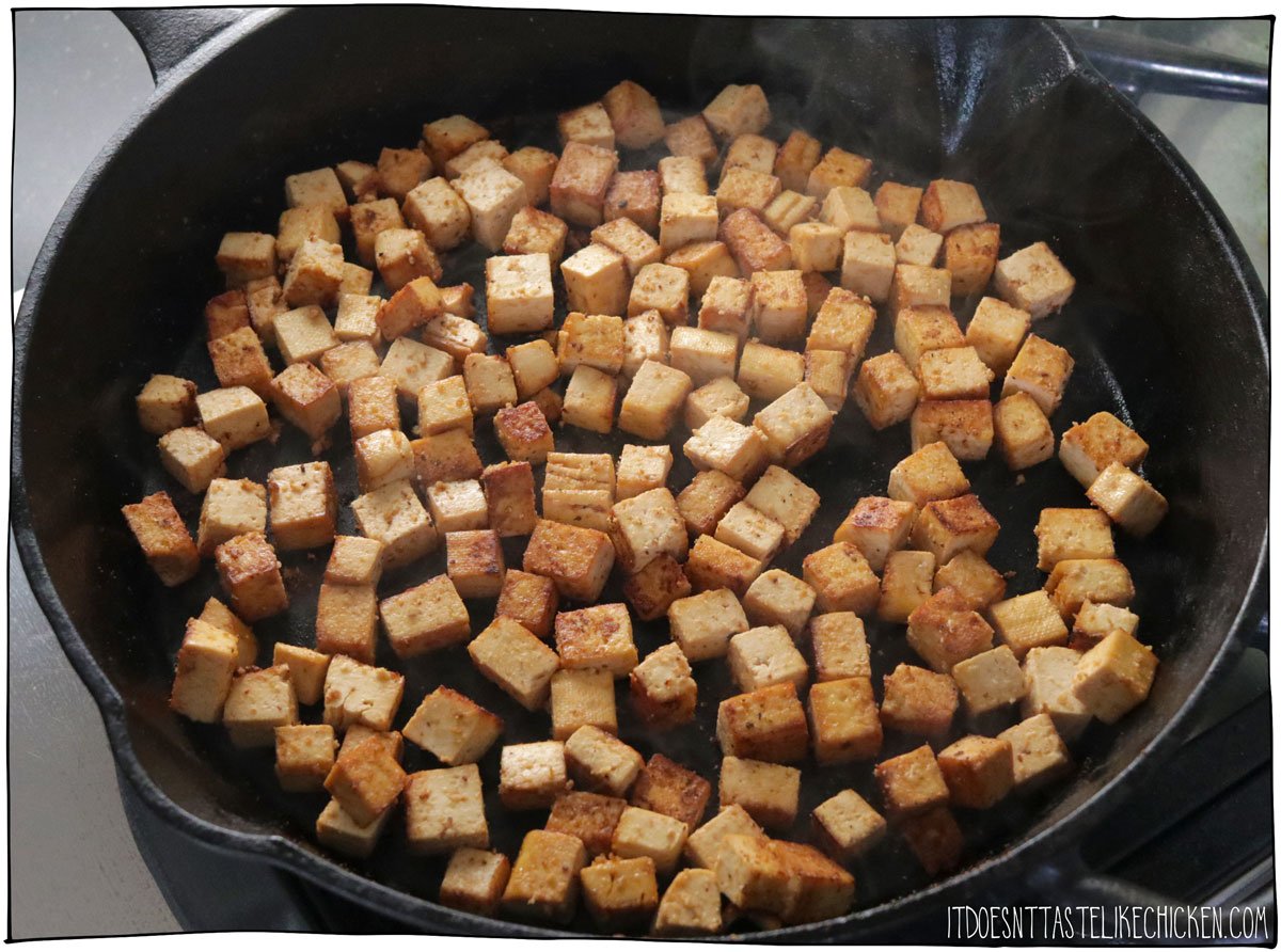 When ready to cook the tofu, heat the remaining ½ tablespoon sesame oil in a large skillet or non-stick pan over medium-high heat. Add the tofu and any remaining marinade. Cook, stirring occasionally, until the tofu is browned all over, about 5 - 10 minutes. Transfer the tofu to a dish and set aside.