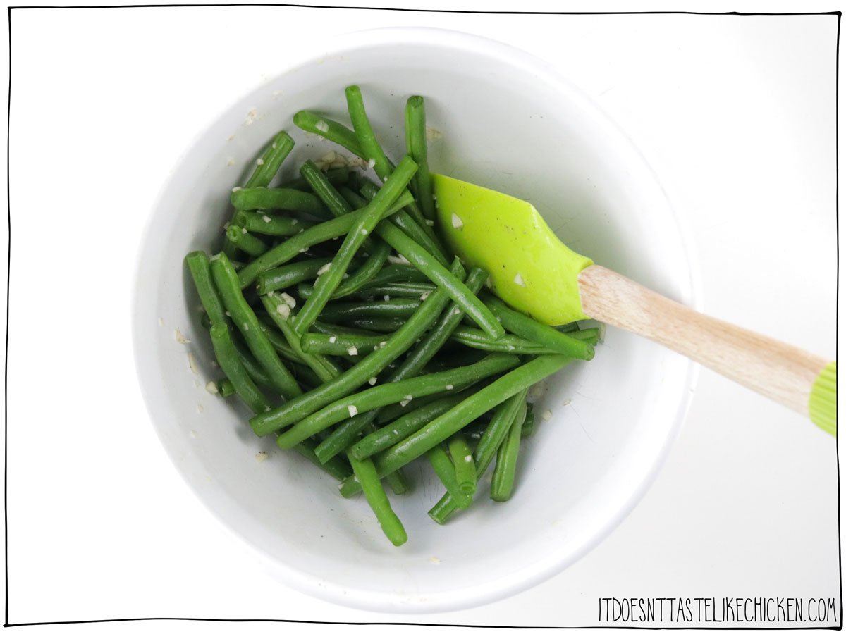 Toss the green beans with garlic and oil.