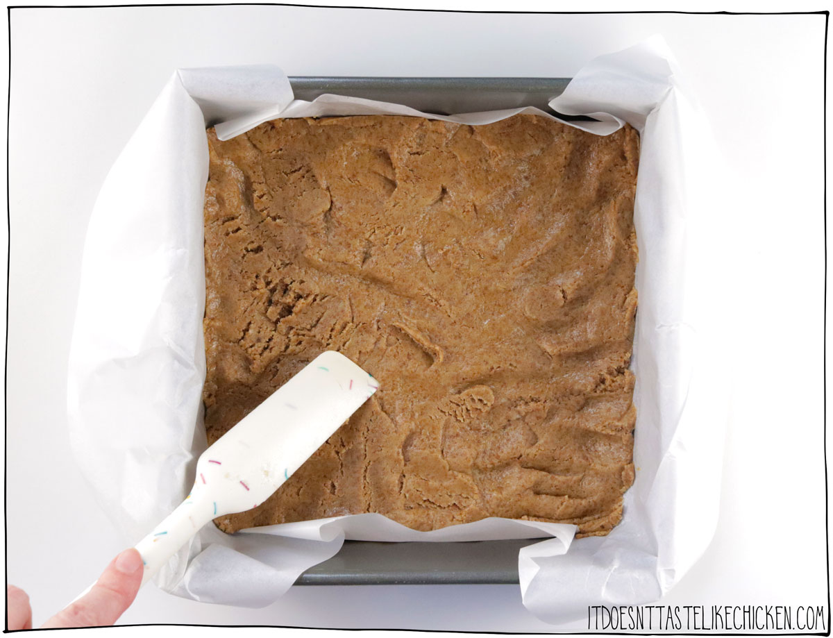 Take about ⅔ of the cookie dough and press it into the bottom of the prepared pan.