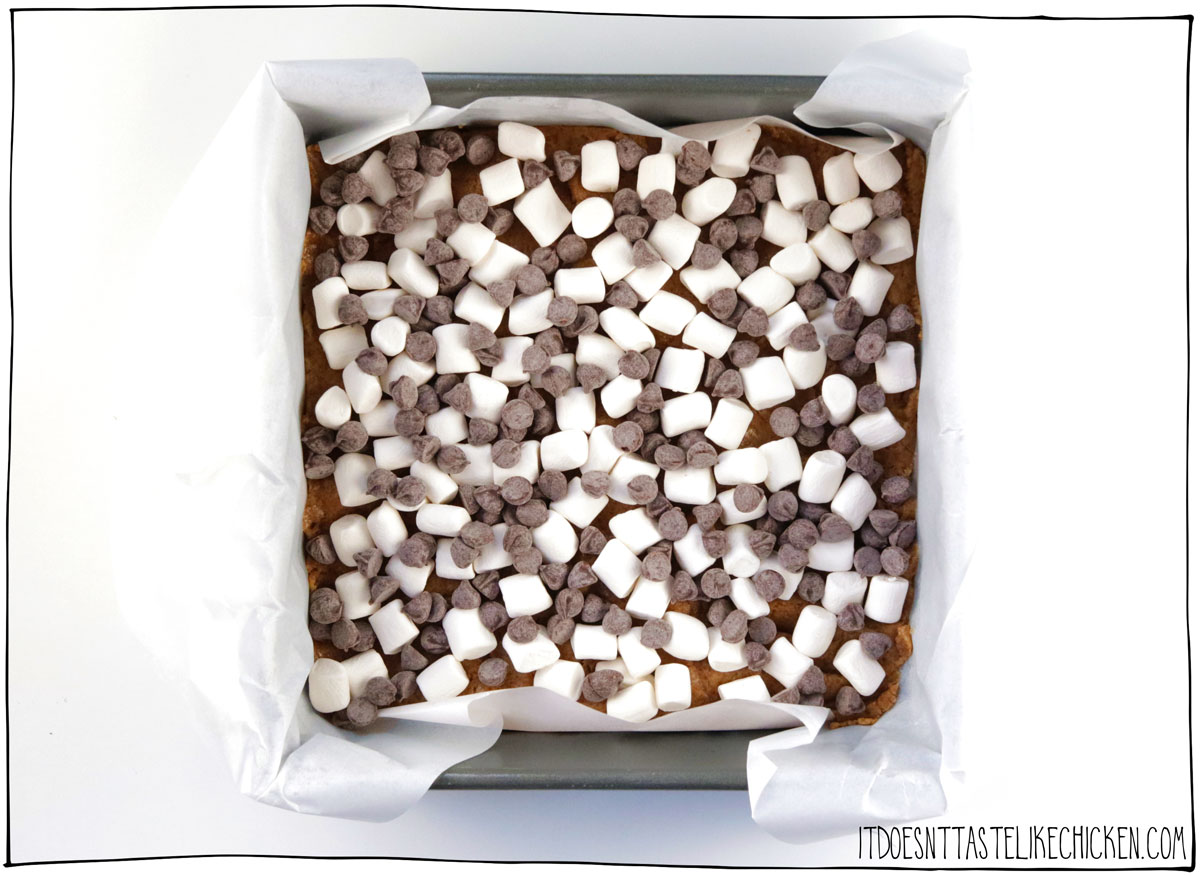 Scatter the marshmallows and chocolate chips evenly over the cookie dough.